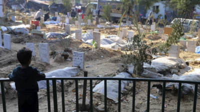Graves of people killed in Israeli bombardments inside Shifa Hospital grounds, December 31, 2023.