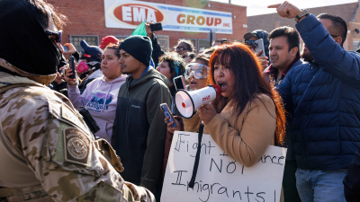 Residents yell at federal agents in Little Village neighborhood, Chicago, October 23, 2025.
