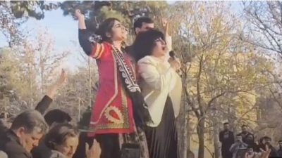 Leading crowd in chants at the 7th-day memorial