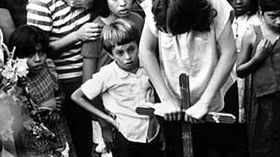 Young girl whose mother was killed by Nicaraguan contras at her mother's burial.