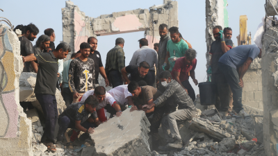 Rescuers search through rubble after the US-Israeli strike on a girls’ elementary school in Minab, Iran, February 28, 2026.