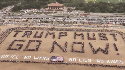 Thousands of protesters gathered at Ocean Beach in San Francisco on No Kings Day, March 28, 2026, to spell out TRUMP MUST GO NOW!
