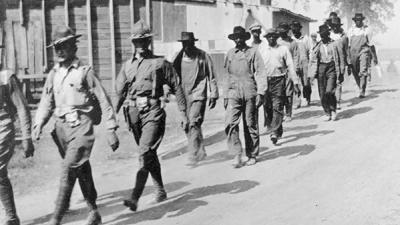 2-USArmy-march-Black-Farmers-ElaineAK-Oct1919-PH-AKStateArchives-600px.jpg