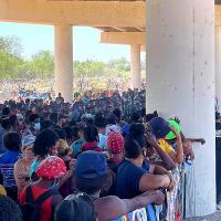Thousands of immigrants, many from Haiti, wait under bridge in Del Rio, Texas.