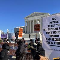 RiseUp4AbortionRights contingent at SCOTUS with banners.