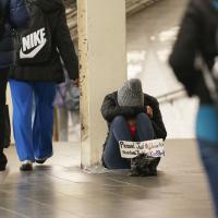 Homeless beg for help in New York City subway.