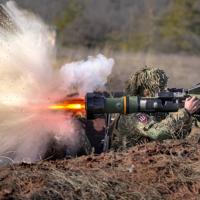 Ukrainian serviceman fires NLAW anti-tank weapon in exercises.