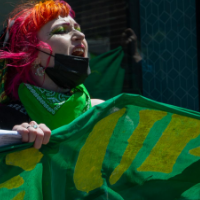 Woman with green banner