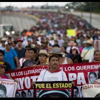 43 Ayotzinapa teachers’ college students’ relatives protest their disappearance one year later.