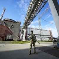 Russian soldier guards Zaporizhzhia nuclear power plant in Ukraine.