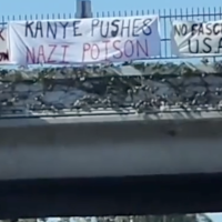 Banners over freeway: Kanye Pushes Nazi Poison, No Fascist USA, We Need Revolution Nothing Less