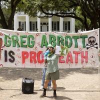 RU4AR in Austin, Texas with banner: "Greg Abbott is Pro Death."