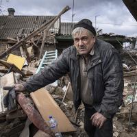 Ukrainian searches through the rubble from Russian rocket, February 21, 2023.