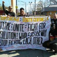 BChicago Revolution Club with banner, that says in part, "...There's a Whole Better Way, Unite, Don't Fight Each Other."