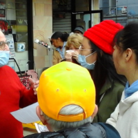 Raymond Lotta greeting May Day marchers at Revolution Books