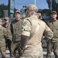 Ukraine battalion officer's neck is tattooed with the symbol of the fascist Azov Batallion, July 2017.