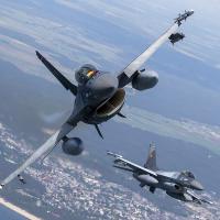 F-16 military fighter jets over Baltic Sea, for Ukraine.