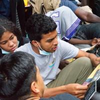 Migrants at Roosevelt Hotel, NYC, read the proclamation, We Are the Revcoms, August 1, 2023.