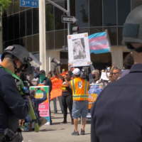 Revcoms defending the rights and lives of people under attack by anti-LGBTQ fascists in and out of government, at the Los Angeles Unified School District meeting.