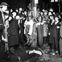 A postcard, a popular souvenir, showed a crowd of thousands of whites watching as three Black men were lynched, Duluth, Minnesota, June 15, 1920.