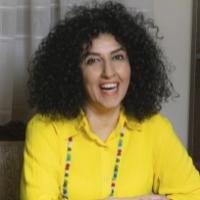 Narges Mohammadi in yellow sweater