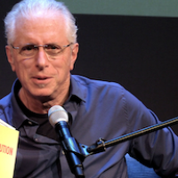 Andy Zee holding Constitution for the New Socialist Republic in North America