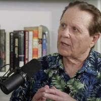 Headshot of Bob Avakian being interviewed