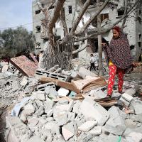 Gaza strip residents search rubble from Israeli bombing, March 29, 2024.