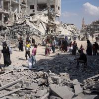 Palestinians search rubble after Israeli air and ground offensive in Khan Younis, April 8, 2024.