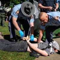 Georgia State Patrol detain a protester at a Pro-Palestinian protest at Emory University, April 25, 2024.