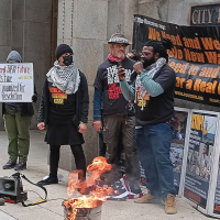The Revcom Corps for the Emancipation of Humanity in Chicago, including one person who is a Vietnam-era veteran, burned an American flag in front of City Hall, April 1, 2024.