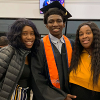 Dexter Reed, center, along with his mother Nicole Banks and sister Porscha Banks, 2019.