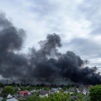 Black smoke fills the horizon after a Russian attack in Kharkiv, Ukraine, May 17, 2024.