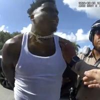 This body cam image from Miami-Dade Police shows Miami Dolphins receiver Tyreek Hill being arrested during a traffic stop, September 8, 2024. 