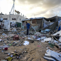 Palestinians inspect damage at tent area, September 9, 2024.