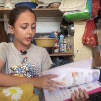 A girl in Gaza with a school book