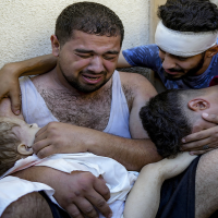 Men with dead child in Gaza