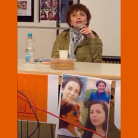 Somayeh Kargar, with poster of four women political prisoners in Iran falsely charged with “armed rebellion against the Islamic regime”, a capital crime.
