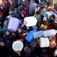 Displaced Palestinians queue for water at makeshift tent camp in Khan Younis, July 1, 2024.