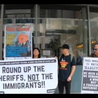 Revcoms protest the San Diego County Sheriff, who said her office won’t comply with the city’s new sanctuary policy.