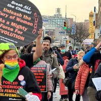 International Women's Day march in Harlem. Sign: Break the Chains Unleash the Fury of Women as a Mighty Force for Revolution!