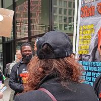 Noche Diaz speaking to individuals at Chicago April 5 protest.