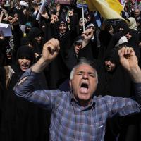 People in Tehran condemn Israeli attacks on multiple cities across Iran, June 20, 2025.