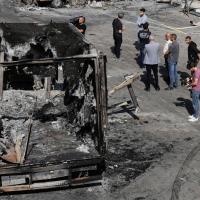Palestinians survey damage from Israeli settlers attack on an industrial zone in West Bank village near Tulkarm, November 12, 2025.