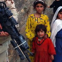 Afghan children look at a U.S special forces member during their raid on a tiny farming village in Konar province, northeast of Kabul.