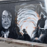 Part of a mural on a Paris street featuring Narges Mohammadi and scenes from the Woman, Life, Freedom uprising of 2022. (IG: @claks_one)