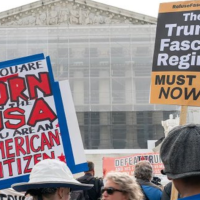 Protest signs at Supreme Court