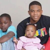 Emeshyon Wilkins in a family photo with his younger siblings, 2024