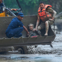 Rescuing a victim of flash flooding along the Trishuli River in Nepal, August 26, 2026.