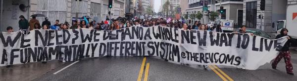 Los Angeles RevCom Corps banner leads march, February 2, 2025.
